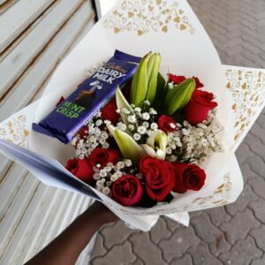 RED ROSES MIXED WITH LILIES & GYPSO & A CADBURY